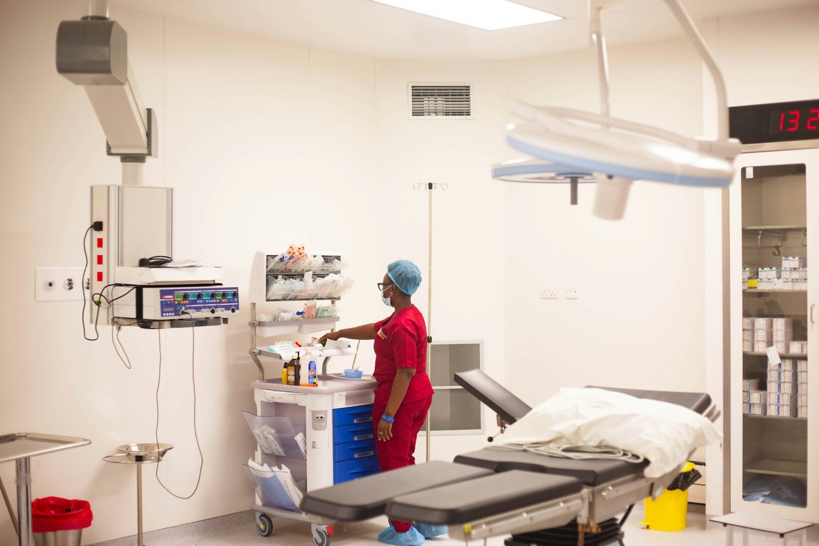 Nurse preparing equipment in a modern operating room